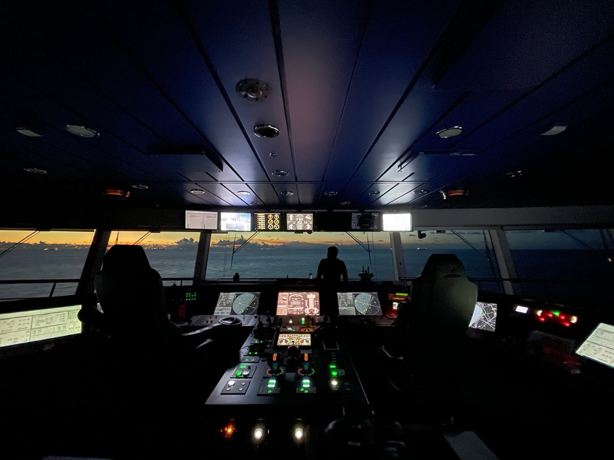 Operator at a ship control room console